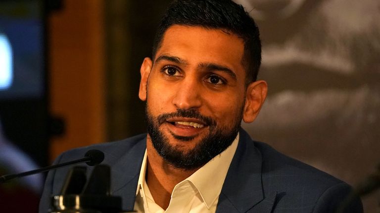 Amir Khan has announced he is "hanging up his gloves"