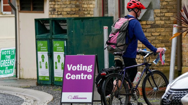 A man arrives to vote early in Sydney on 9 May. Pic: AP