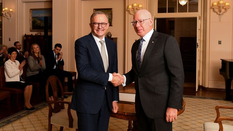 Australian Prime Minister Anthony Albanese shakes hands with Australian Governor-General David Hurley during swearing in ceremony at Government House in Canberra