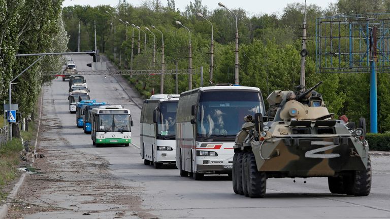 Buses carrying service members of Ukrainian forces who have surrendered after weeks holed up at Azovstal steel works drive away under escort of the pro-Russian military in the course of Ukraine-Russia conflict in Mariupol, Ukraine May 17, 2022. REUTERS/Alexander Ermochenko
