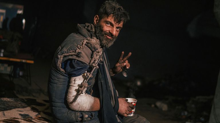 In this photo provided by Azov Special Forces Regiment of the Ukrainian National Guard Press Office, an Azov Special Forces Regiment&#39;s serviceman, injured during fighting against Russian forces, poses for a photographer inside the Azovstal steel plant in Mariupol, Ukraine, Tuesday, May 10, 2022. (Dmytro &#39;Orest&#39; Kozatskyi/Azov Special Forces Regiment of the Ukrainian National Guard Press Office via AP)