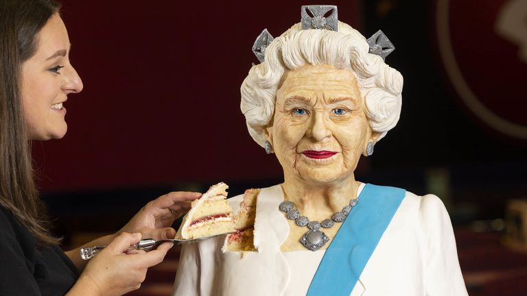     Baker Lara Mason of Cake Anything unveils a life-size Queen Elizabeth II cake she made to celebrate the Platinum Jubilee on Buzz Bingo Kingsbury Road in Birmingham