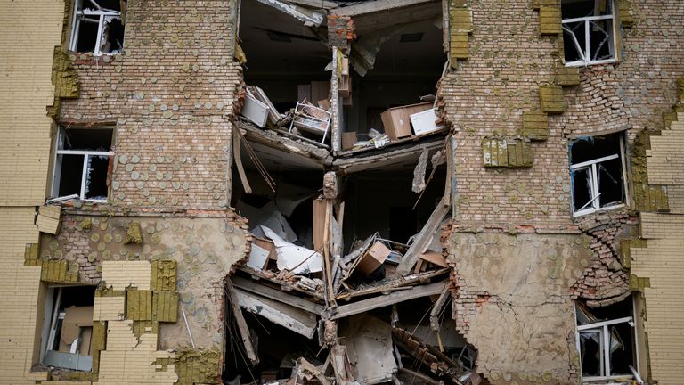 Debris hangs from a residential building heavily damaged in a Russian bombing in Bakhmut, eastern Ukraine, eastern Ukraine, Saturday, May 28, 2022. Fighting has raged around Lysychansk and neighbouring Sievierodonetsk, the last major cities under Ukrainian control in Luhansk region. (AP Photo/Francisco Seco)
