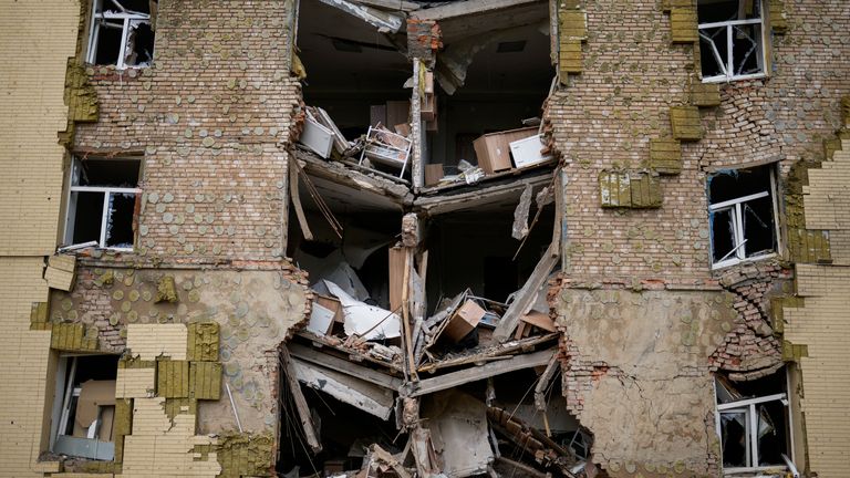 Debris hangs from a residential building heavily damaged by a Russian bombing in Bakhmut, eastern Ukraine, eastern Ukraine, Saturday, May 28, 2022. Fighting broke out in around Lysychansk and nearby Sievierodonetsk, the last major cities under Ukrainian control in the Luhansk region.  (AP Photo / Francisco Seco)