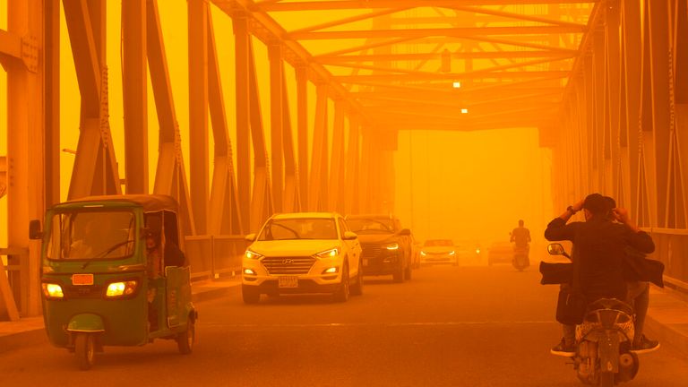 A storm turned the sky orange in Basra, Iraq, on May 16. Photo: AP