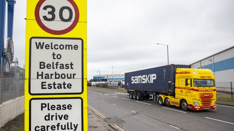 Haulage lorry drives passed a sign at Belfast Port welcoming travellers to the Harbour Estate.
