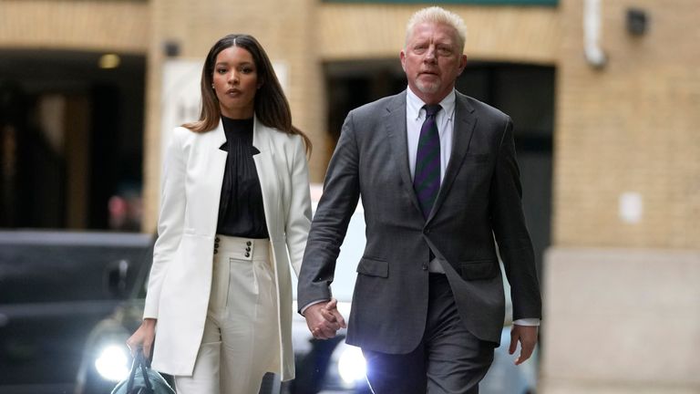 Former tennis player Boris Becker and his partner Lilian de Carvalho Monteiro Southwark Crown Court in London, Friday, April 29, 2022. Becker is in court for failing to hand over trophies from his glittering tennis career to settle debts, relating to charges over his bankruptcy. (AP Photo/Frank Augstein)