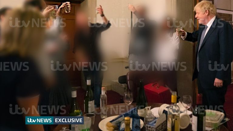 ITV handout photo dated 13/11/20 of a photograph obtained by ITV News of the Prime Minister raising a glass at a leaving party on 13th November 2020, with bottles of alcohol and party food on the table in front of him. Issue date: Monday May 23, 2022.
