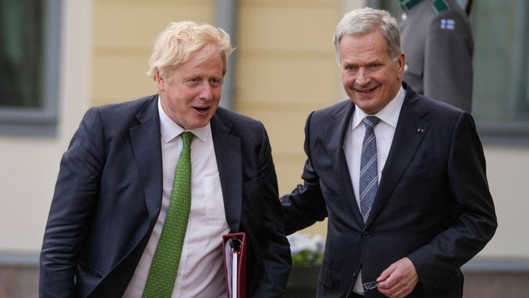 British Prime Minister Boris Johnson is greeted by Finnish President Sauli Niinisto ahead of delegation discussions on Russia's continued invasion of Ukraine and security in Europe, at the Presidential Palace, in Helsinki, Finland , May 11, 2022 .  Frank Augstein / Pool via REUTERS