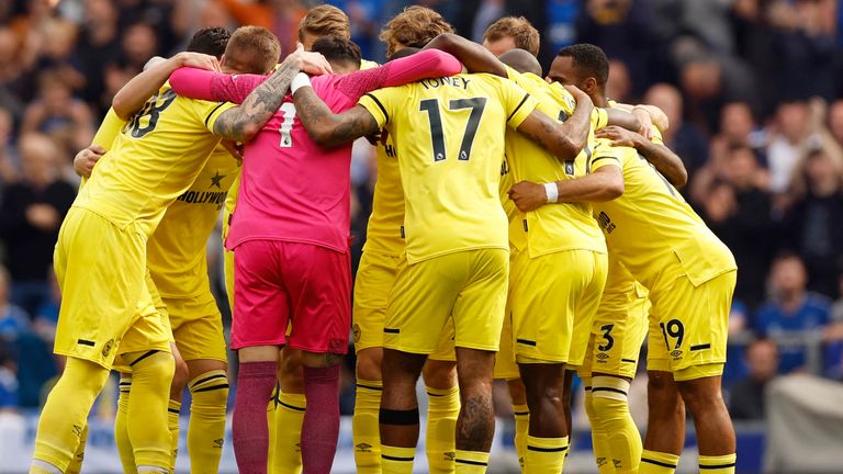 Brentford players in a huddle before their match against Everton at Goodison Park
