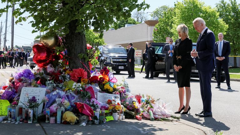 U.S. President Joe Biden and first lady Jill Biden pay their respects to the 10 people killed in a mass shooting by a gunman authorities say was motivated by racism, at the TOPS Friendly Markets memorial site in Buffalo, NY, U.S. May 17, 2022. REUTERS/Leah Millis
