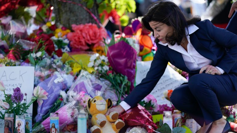 New York Gov. Kathy Hochul looks at a memorial at the scene of the shooting Pic: AP