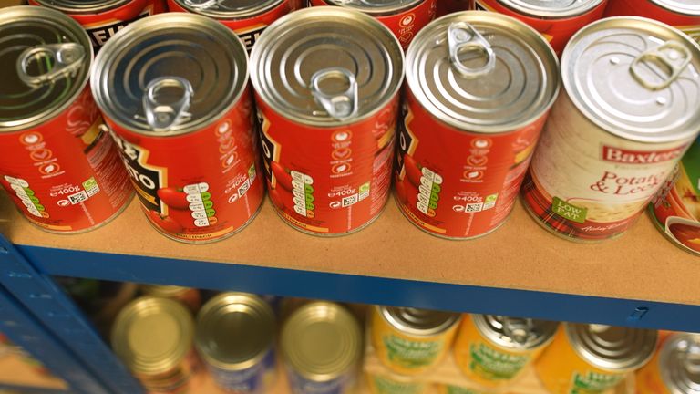 Tins are stacked at the food pantry