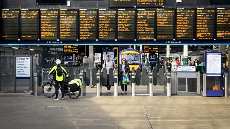 Commuters and travellers at Edinburgh&#39;s Waverley Station. ScotRail&#39;s new timetable, which will see almost 700 fewer train services a day across Scotland, begins today whilst the deadlock over driver pay continues. Picture date: Monday May 23, 2022.
