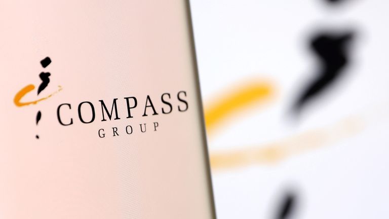 Compass Group&#39;s logo is pictured on a smartphone in this illustration taken, December 4, 2021