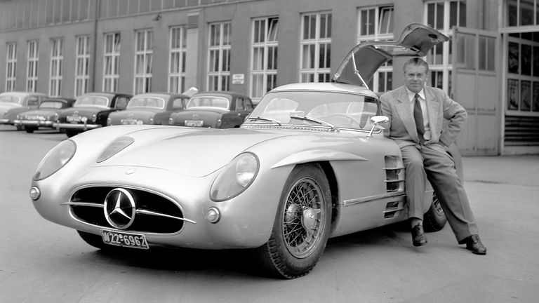  picture shows one of the two 300 SLR Uhlenhaut Coup..s together with the inventor Rudolph Uhlenhaut. This vehicle is on display in the Mercedes-Benz Museum..