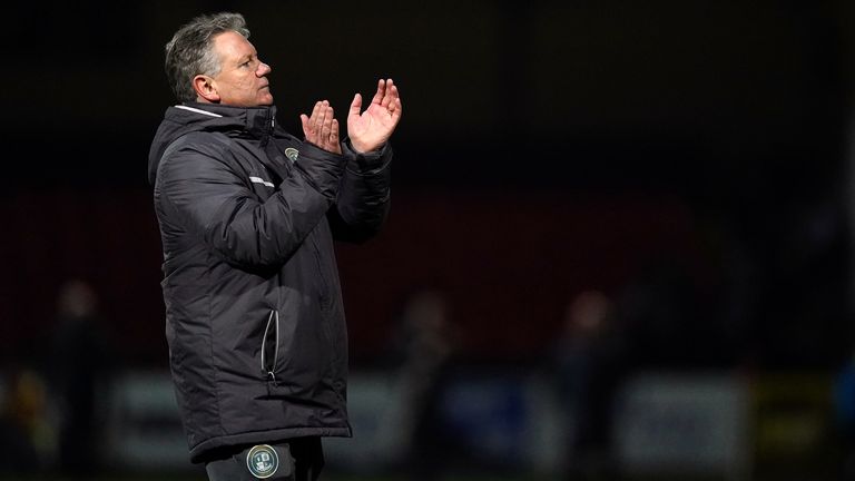 Crawley Town manager John Yems applauds the fans after the Sky Bet League Two match at the County Ground, Swindon. Picture date: Tuesday February 1, 2022.