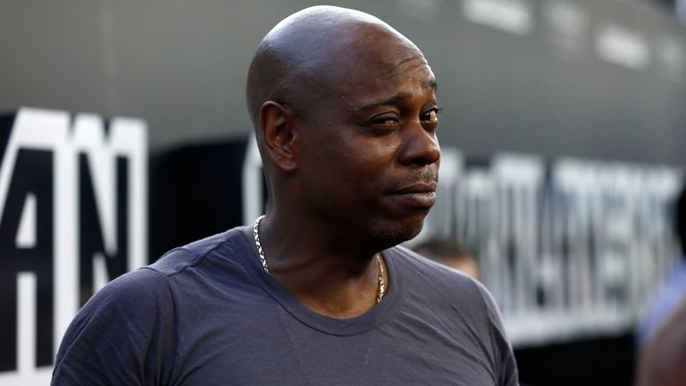 Comedian Dave Chappelle poses at the premiere "black klansman" August 8, 2018, Beverly Hills, California, USA.