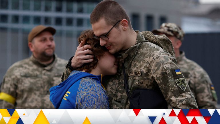 Territorial Defence Force member Dimitry, who turns 22 the day after, hugs his girlfriend Valentine, 17, before boarding a train for the front line, amid Russia&#39;s invasion of Ukraine, in Kyiv, Ukraine, May 25, 2022. REUTERS/Edgar Su