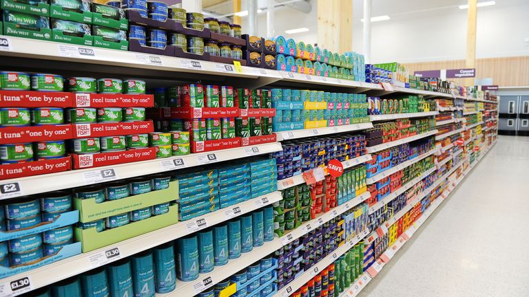 Supermarket interior displaying canned fish, UK, UK -  