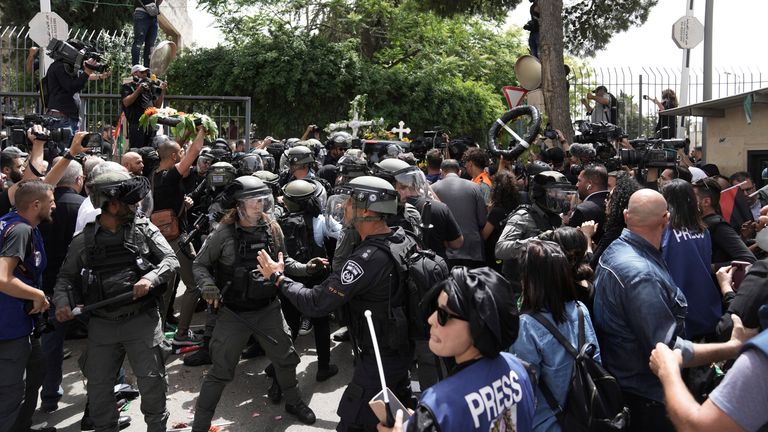Israeli police in riot gear confront mourners and the journalists covering the transfer from the hospital of slain Al Jazeera veteran journalist Shireen Abu Akleh to her final resting place. Pic: AP