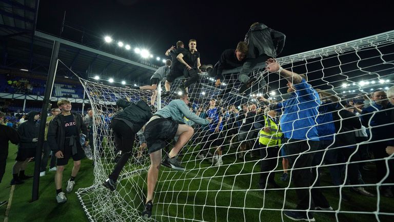 Everton fans celebrate victory over Christal Palace during the English Premier League football match between Everton and Crystal Palace at Goodison Park in Liverpool, England, Thursday, May 19, 2022. (AP Photo / Jon Super)