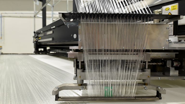 Fibre glass in a giant loom is pictured at the Open Hybrid Lab Factory, which is a research and development center of several companies like German car maker Volkswagen, during a media tour to present Volkswagen&#39;s so called "Blaue Fabrik" (Blue Factory) environmental program, in Wolfsburg, Germany May 19, 2017. REUTERS/Fabian Bimmer