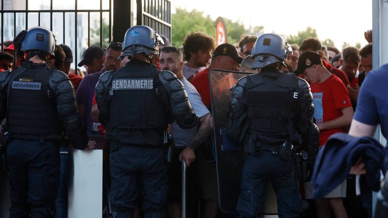 FOOTBALL - UEFA Champions League final - Liverpool vs Real Madrid - Stade de France in Saint-Denis near Paris, France - Fans and police at the turnstiles inside the stadium as the match is postponed REUTERS/Gonzalo Fuentes