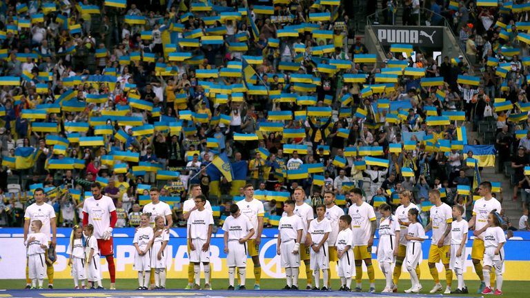 Soccer Football - Friendly - A match for peace and the end of war in Ukraine - Borussia Moenchengladbach v Ukraine - Borussia-Park, Moenchengladbach, Germany - May 11, 2022 Ukraine players line up with young mascots before the match REUTERS/Thilo Schmuelgen TPX IMAGES OF THE DAY