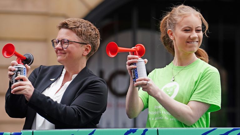 Freya Lewis (right), start the Great Manchester Run through Manchester city centre