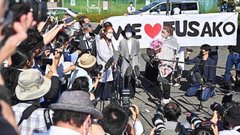 Fusako Shigenobu (C), Japanese communist activist and the former leader and founder of the now disbanded terrorist group, the Japanese Red Army (JRA), is released after her sentence in Akishima City, Tokyo on May 28, 2022. Fusako Shigenobu was charged as joint principals in a conspiracy the 1974 French Embassy attack in The Hague and sentenced to 20 years in prison. ( The Yomiuri Shimbun via AP Images )