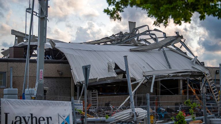 The roof of a construction machinery dealer was destroyed in Paderborn. Pic: AP