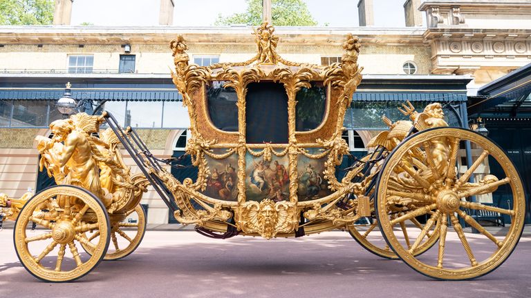 General view of the Gold State Coach, at the Royal Mews, Buckingham Palace, London. The coach will be used as part of Queen&#39;s Platinum Jubilee celebrations. Picture date: Friday May 6, 2022.
