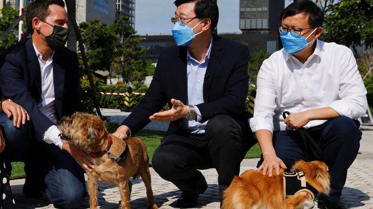 Hong Kong sole Chief Executive candidate John Lee greets people ahead of the Chief Executive election, in Hong Kong, China, May 4, 2022