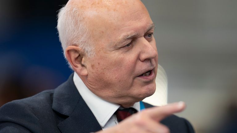 Former leader of the Conservative Party Iain Duncan Smith speaks during a television interview at the Conservative Party Conference in Manchester, England, Tuesday, Oct. 5, 2021. (AP Photo/Jon Super)