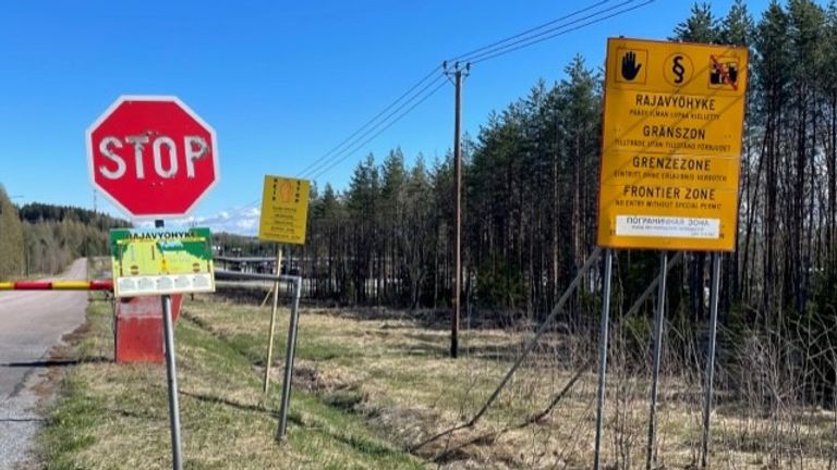 Signs reading "stop" and "frontier" zone at border crossing to Russia near Imatra, Finland; 13 May 2022