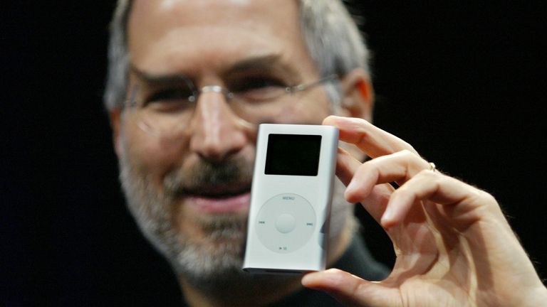 Apple CEO Steve Jobs introduces the new "iPod mini" digital music player at the 2004 Macworld Conference and Expo in San Francisco January 6, 2004. The player which can hold up to 1,000 tunes is about the size of a business card and will retail for $249. REUTERS/Lou Dematteis LD/JDP
