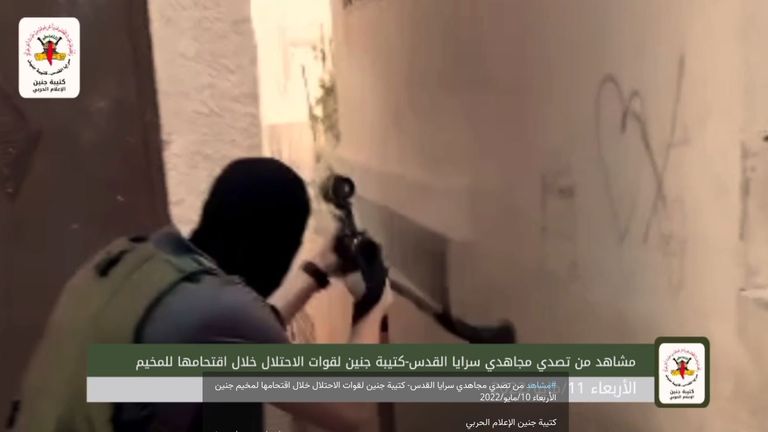 The footage of a masked man shooting down an alley appears to have originally been posted onto a Telegram channel by Palestinian militants. Pic: Saraya Al Quds 