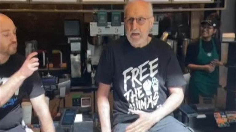 James Cromwell glues himself to a coffee shop counter in plant-based milk charges protest