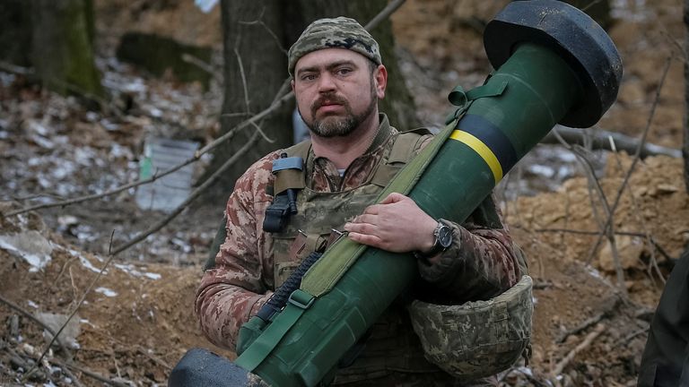 A Ukrainian soldier holding a Javelin missile system on the front line in Kyiv
