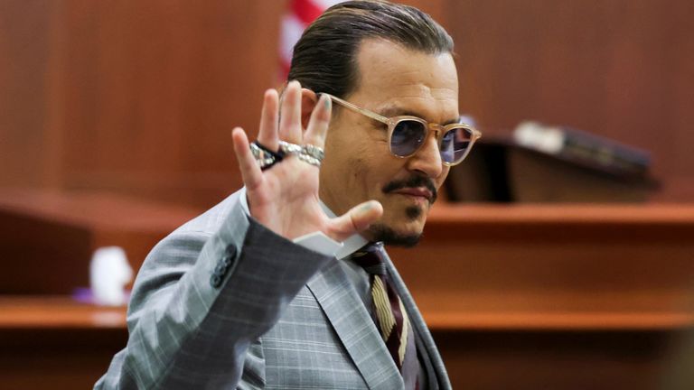 Actor Johnny Depp reacts as he leaves for a break during the Depp vs Heard defamation trial at the Fairfax County Circuit Court in Fairfax, Virginia, U.S. May 26, 2022. Michael Reynolds/Pool via REUTERS
