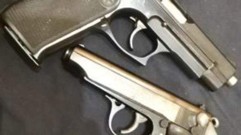 Handguns pictured in an EncroChat message uncovered by officers. Pic: NCA
