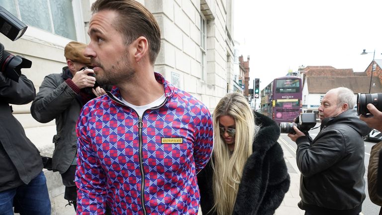 Katie Price alongside fiancee Carl Woods arrives at Lewes Crown Court, West Sussex, where she is appearing on charges of breaching a restraining order. Picture date: Wednesday May 25, 2022.
