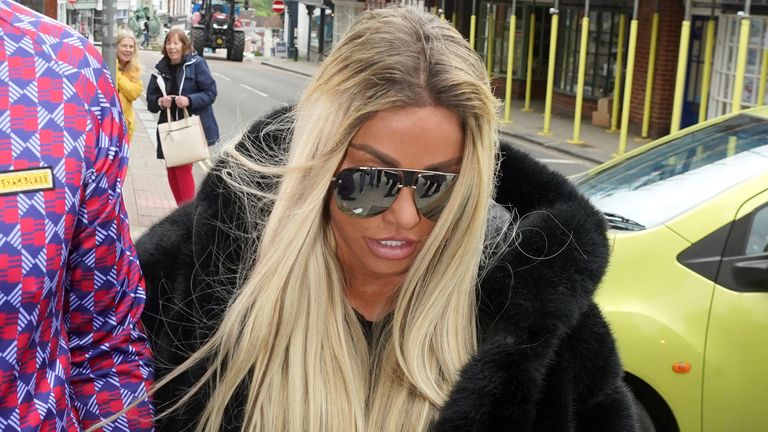Katie Price alongside fiancee Carl Woods arrives at Lewes Crown Court, West Sussex, where she is appearing on charges of breaching a restraining order. Picture date: Wednesday May 25, 2022.
