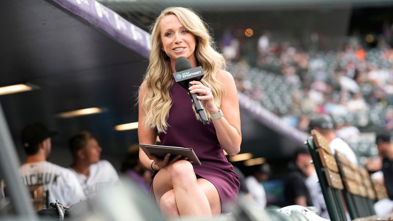 Colorado Rockies televsion reporter Kelsey Wingert does a spot from the first-base well before the first inning of a game against the San Francisco Giants Monday, May 16, 2022, in Denver. Wingert was hit by a foul off the bat of San Francisco Giants... Austin Slater in the ninth inning of a baseball game Monday, May 16, 2022, in Denver. The announcer, who was seated in the first-base camera well, was taken from the game after being struck in the head by the ball. (AP Photo/David Zalubowski)..................