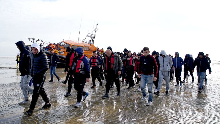 A group of people thought to be migrants are brought in to Dungeness, Kent, onboard the RNLI Dungeness Lifeboat, following a small boat incident in the Channel. Picture date: Tuesday May 17, 2022.
