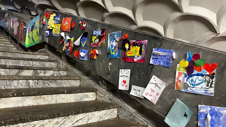 Children&#39;s paintings in the metro