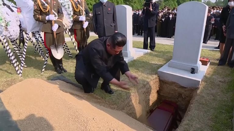Kim Jong Un sprinkles earth on coffin of Hyon Chol Hae
