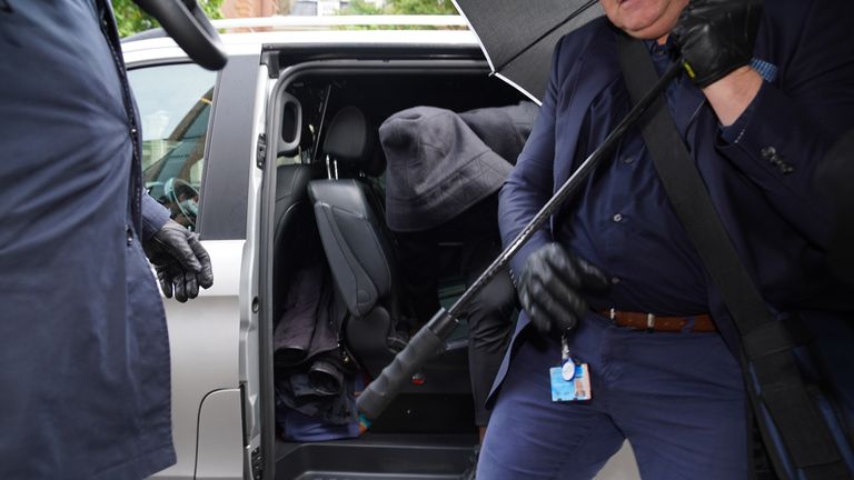 West Ham defender Kurt Zouma hides his face as he arrives at Thames Magistrates&#39; Court, London where he is being prosecuted by the RSPCA under the Animal Welfare Act for kicking his cat. Picture date: Tuesday May 24, 2022.
