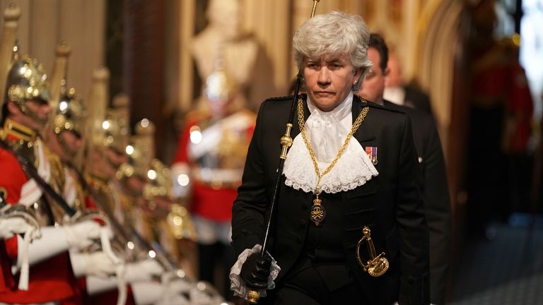 Lady usher of the Black Rod walks through the Norman Porch for the State Opening of Parliament in the House of Lords at the Palace of Westminster in London. Picture date: Tuesday May 10, 2022.
